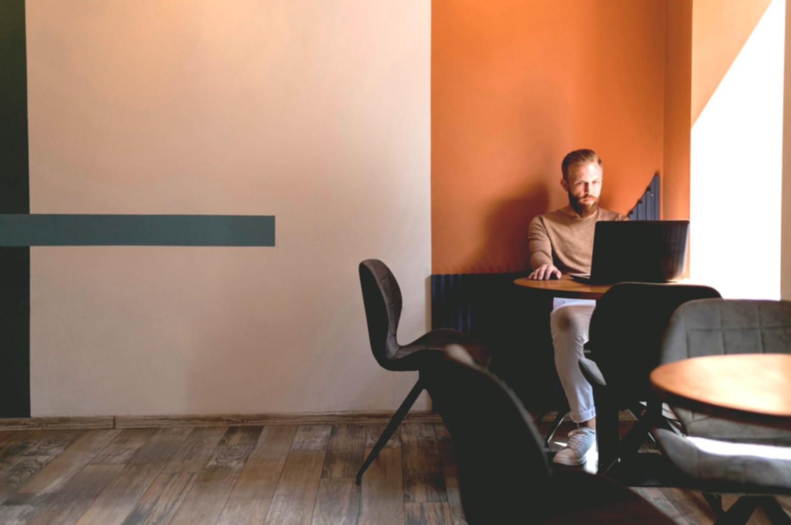 Close-up of hands working with financial calculators and analysis documents